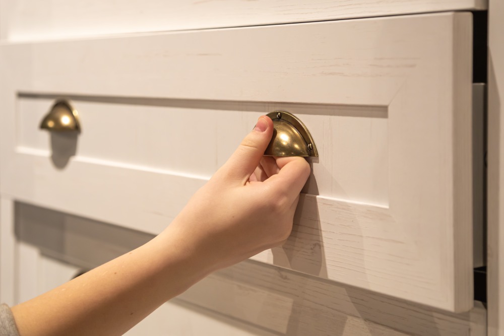 Stylish chest of drawers, close up. Furniture for wardrobe room.
